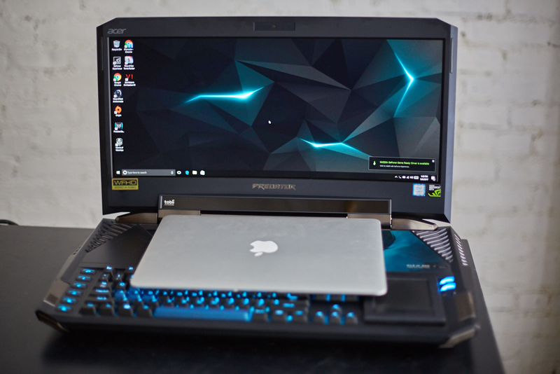 The MacBook Air looks like a toy perched on top of the 21 X.